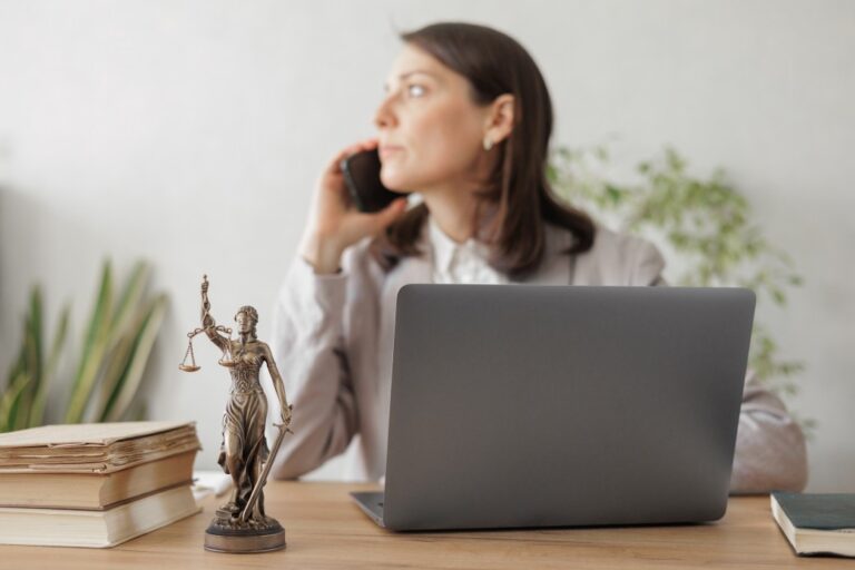 a female paralegal talking to a client over the phone