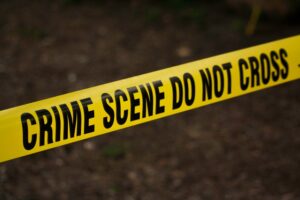 A forensic nurse's nursing resume and cover letter must include the skills essential in a crime scene investigation symbolized by the yellow do not cross tape.