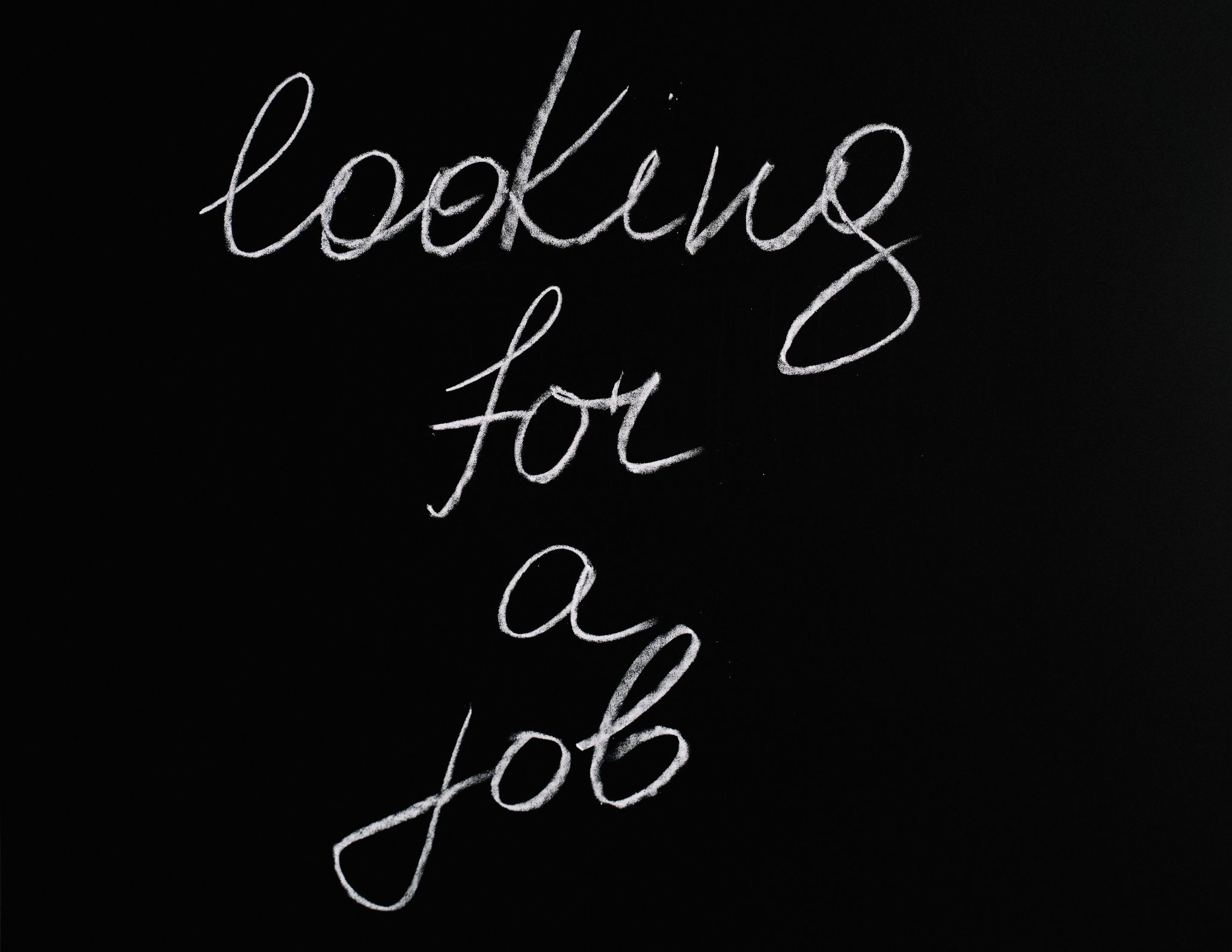 “Looking For A Job” Written On A Black Background