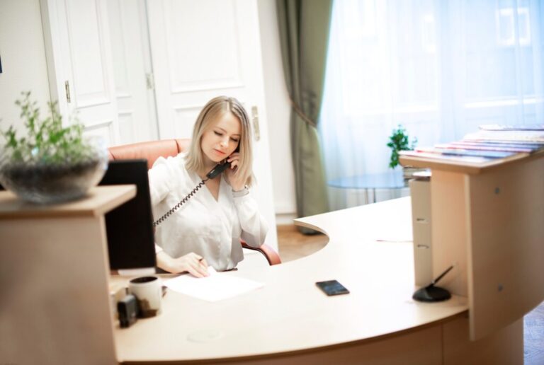 receptionist making calls and doing paperwork