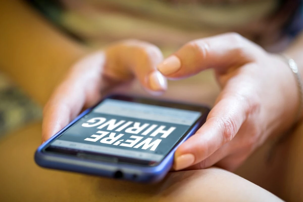 job search hands on phone searching