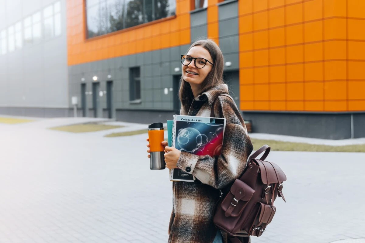 high school student walking inside campus