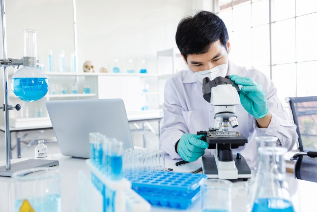 A Clinical Laboratory Technologist Using Microscope