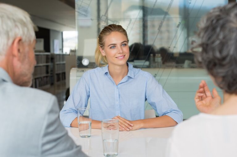 Job interview candidate smiling while thinking how long do job interviews last