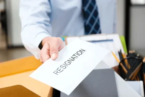 employee handing out a 2 week notice letter for resignation