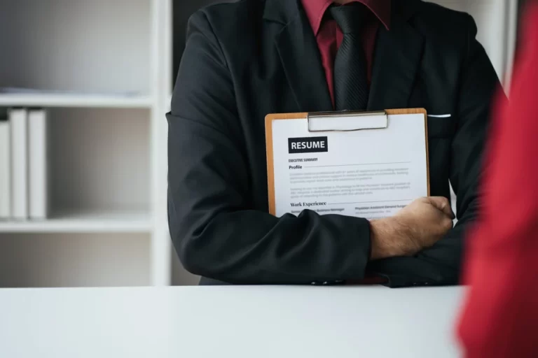 applicant on job search holding his biography for work