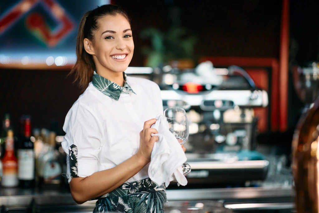 happy female bartender ready to pass her bartender resume