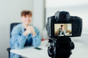 An Applicant Confidently Recording Himself For A Video Resume