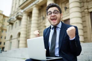 job seeker celebrating successful interview after researching effective elevator pitch examples