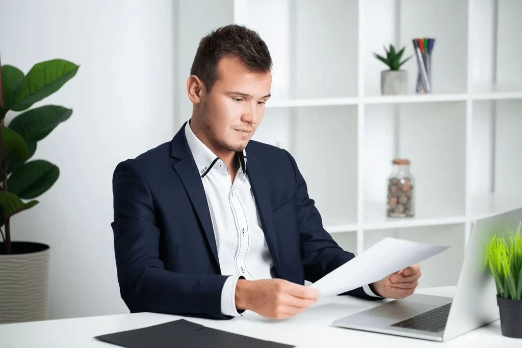 Hiring Manager Reading A List Of References In Resume