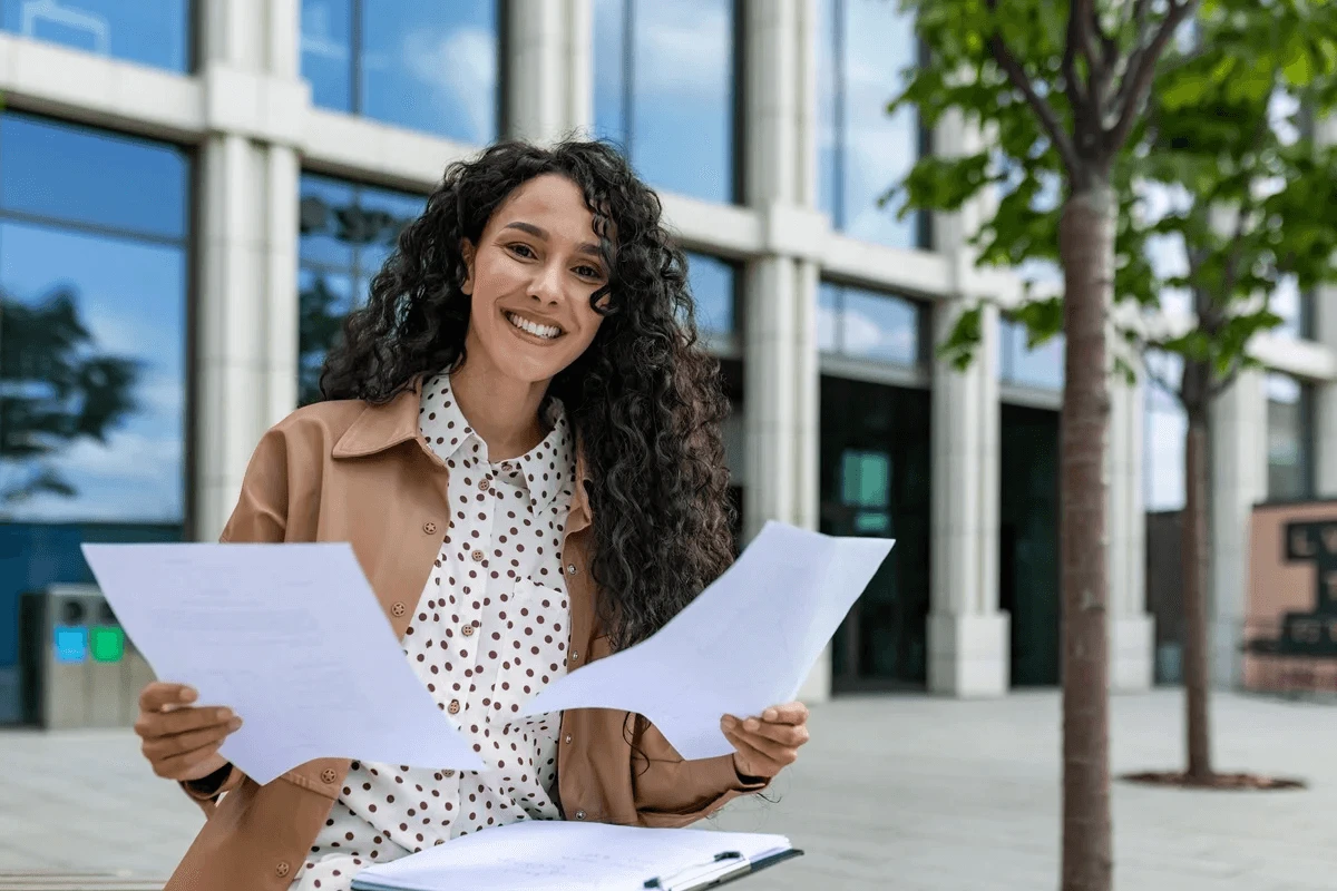college student holding her resume