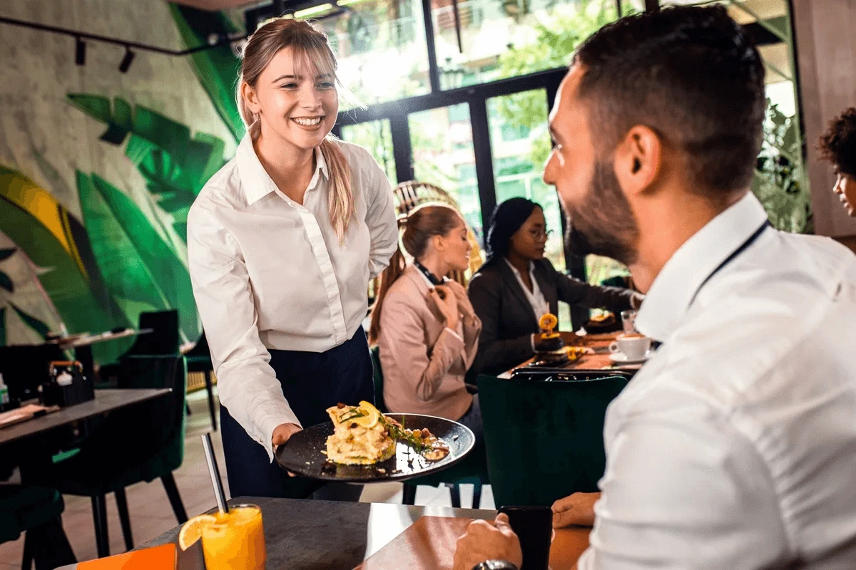 enthusiastic server in a restaurant