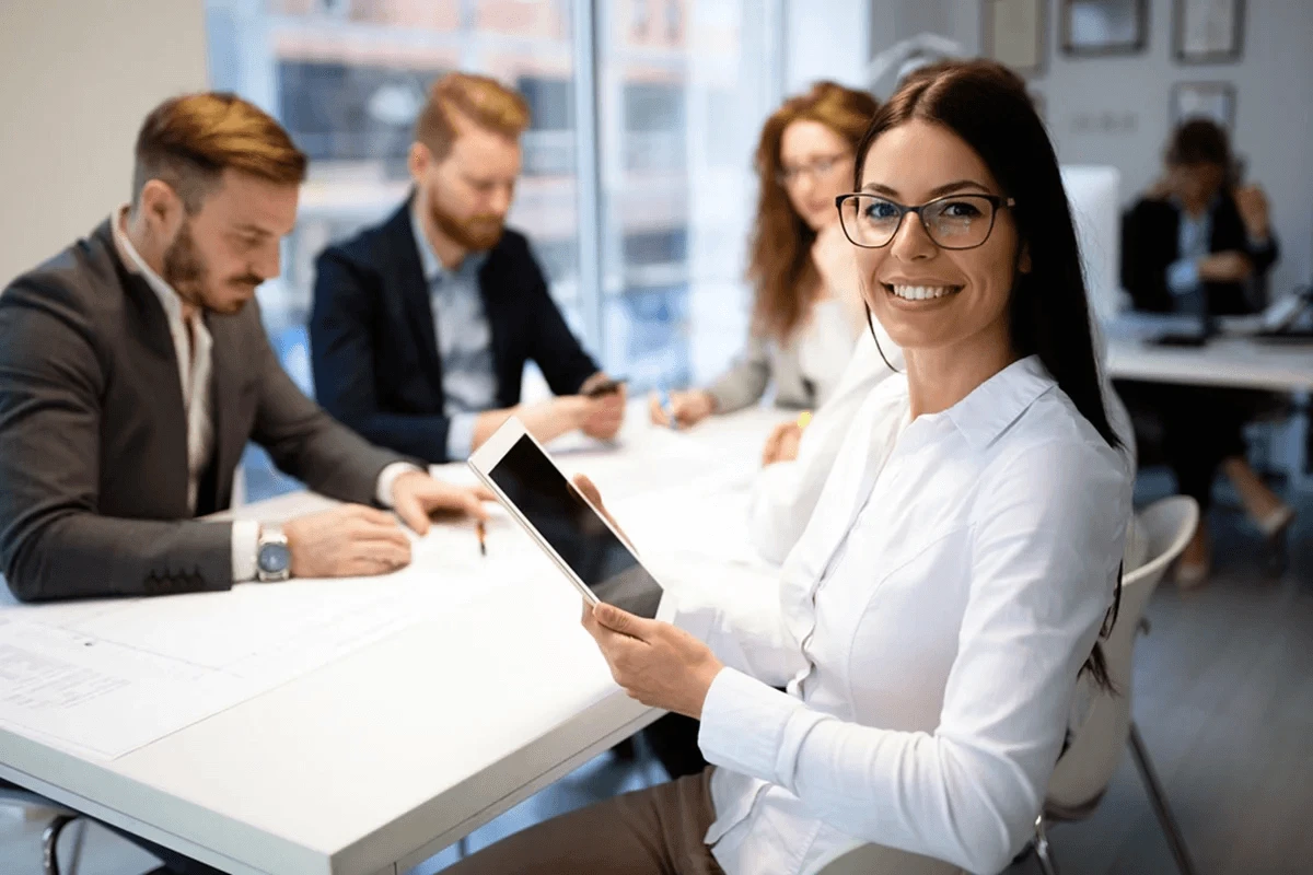 administrative assistant working alongside executives