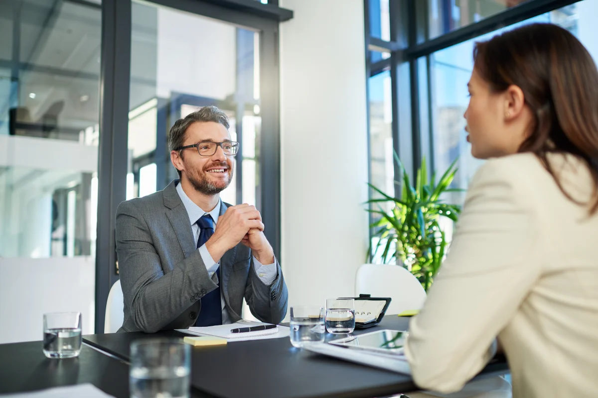 male recruitment manager asking the job seeker the interview question "what are you most proud of"