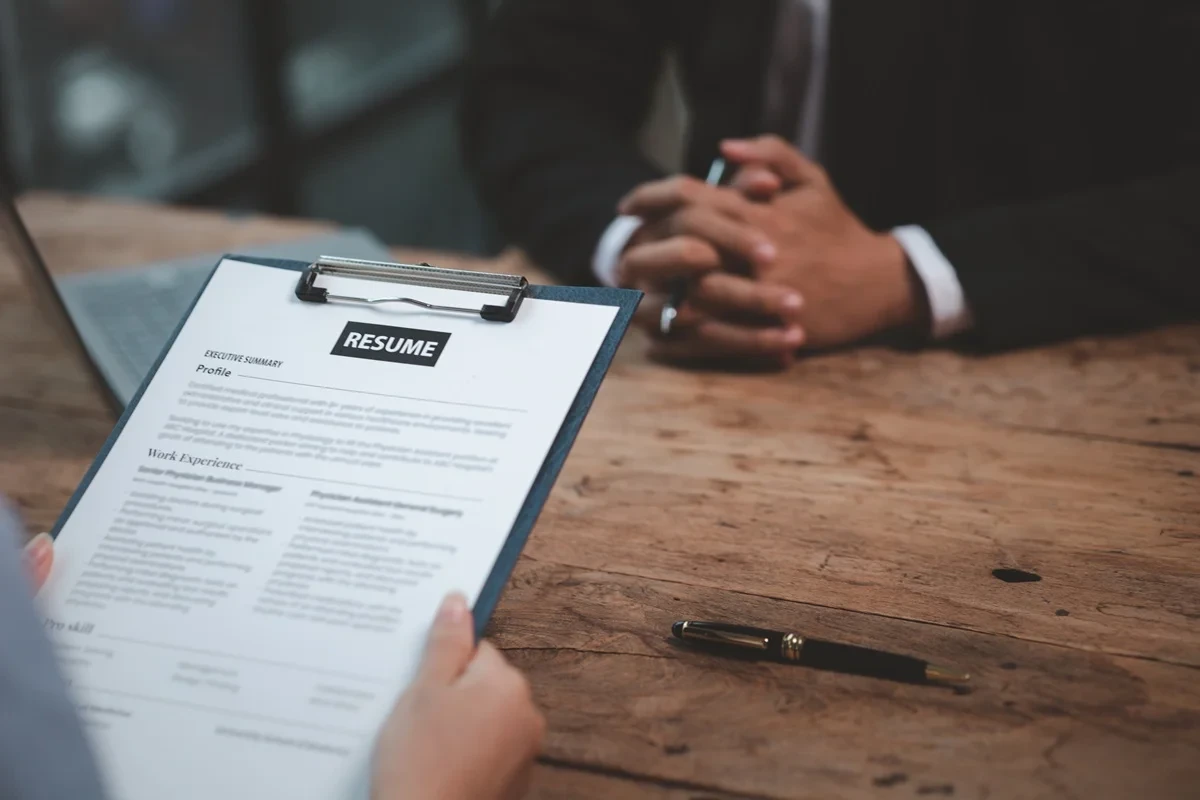 employer reading the resume of an applicant