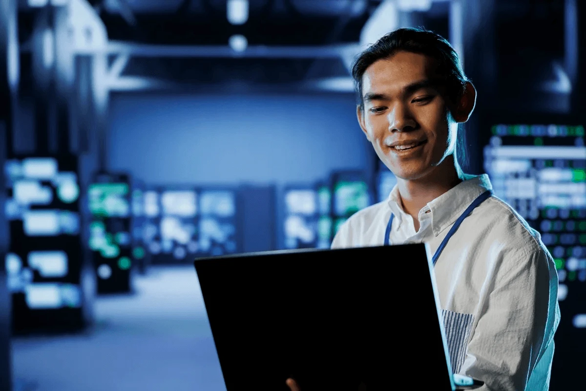 IT professional optimizing his resume using a laptop