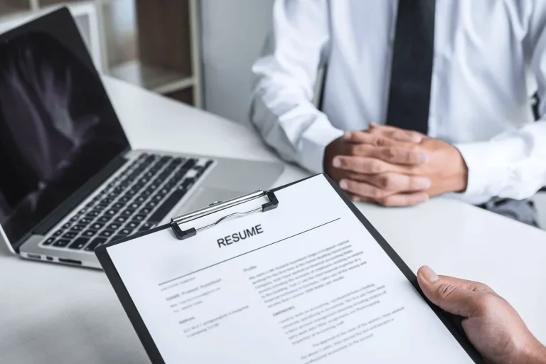 job applicant submitting his resume to an employer