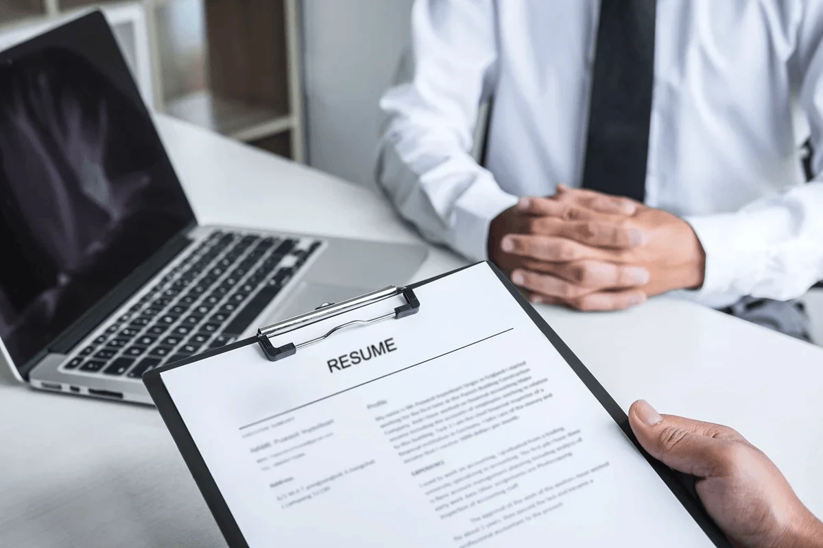 job applicant submitting his resume to an employer