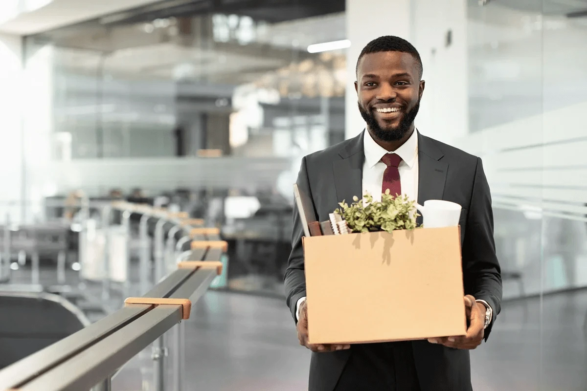 newly hired employee carrying his work stuff