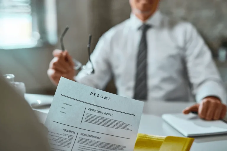 confident applicant handing out his resume