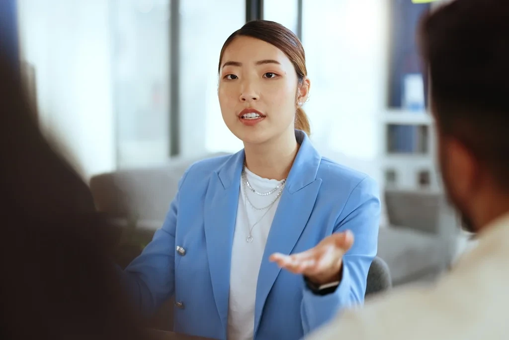 Confident Job Applicant Speaking In A Panel Interview