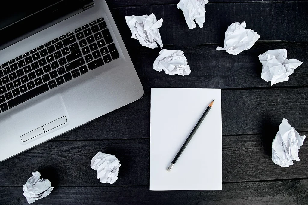 Crumpled Papers Representing Cover Letter Mistakes