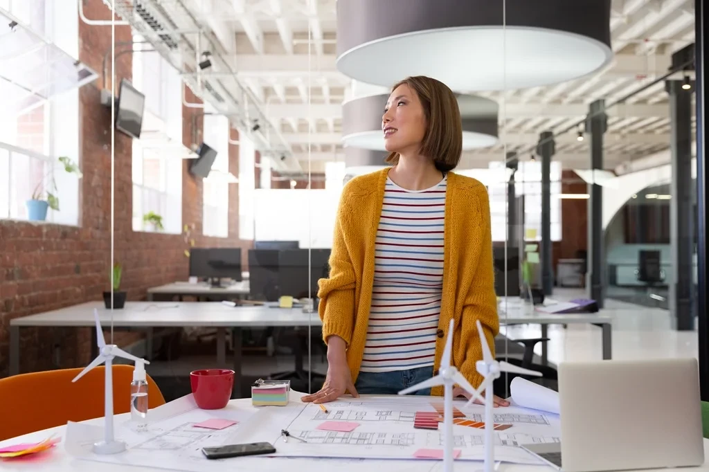Employee Planning Out Her Career Using Various Examples Of Workplace Goals