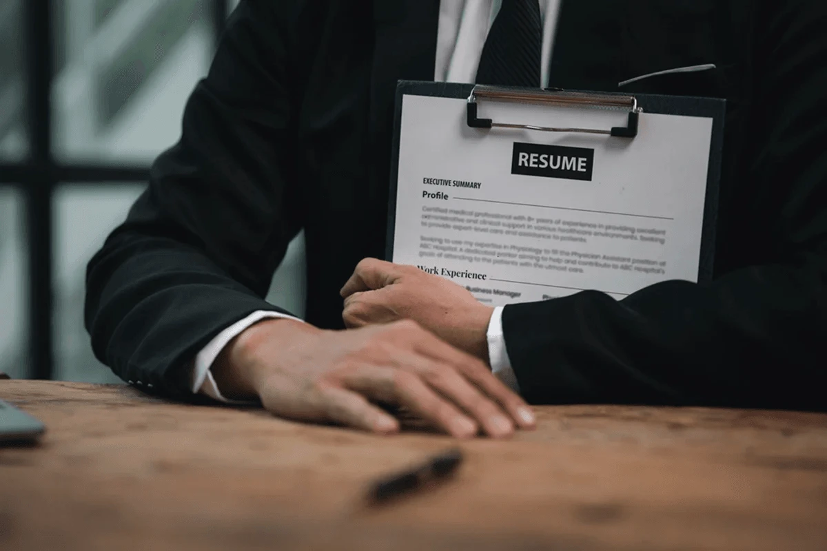 HR staff holding a resume of an applicant