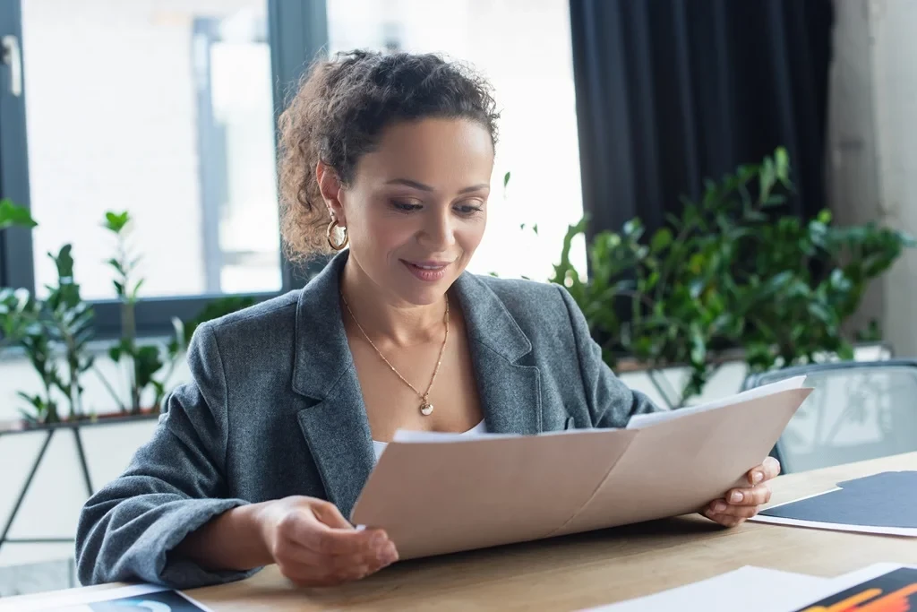 Hr Staff Reading An Application With Cover Letter