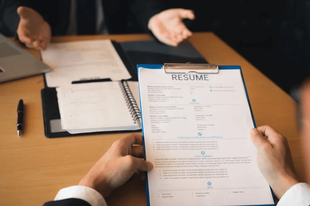 Job Applicant Answering The Questions Of The Employer About His Resume