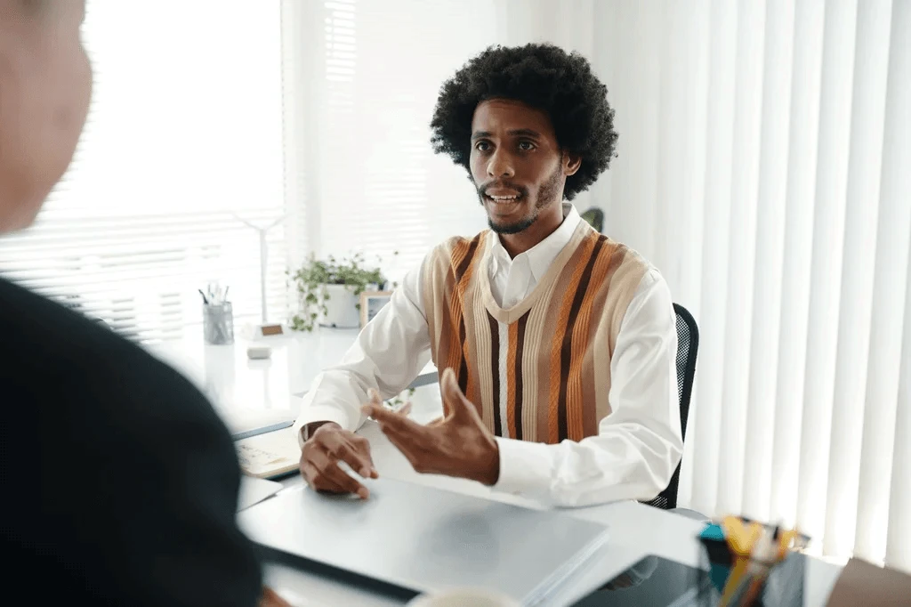 Job Applicant Discussing His Working Style During An Interview
