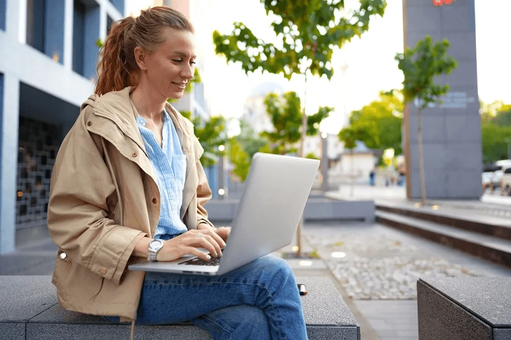 Job Seeker Updating His Resume Profile Using Her Laptop