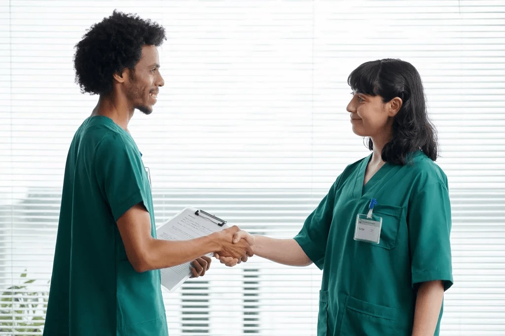 Newly Appointed Nurse Shaking The Hands Of The Head Nurse