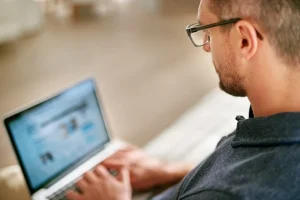 Professional Reviewing Her Profile Visiting Activities On Linkedin