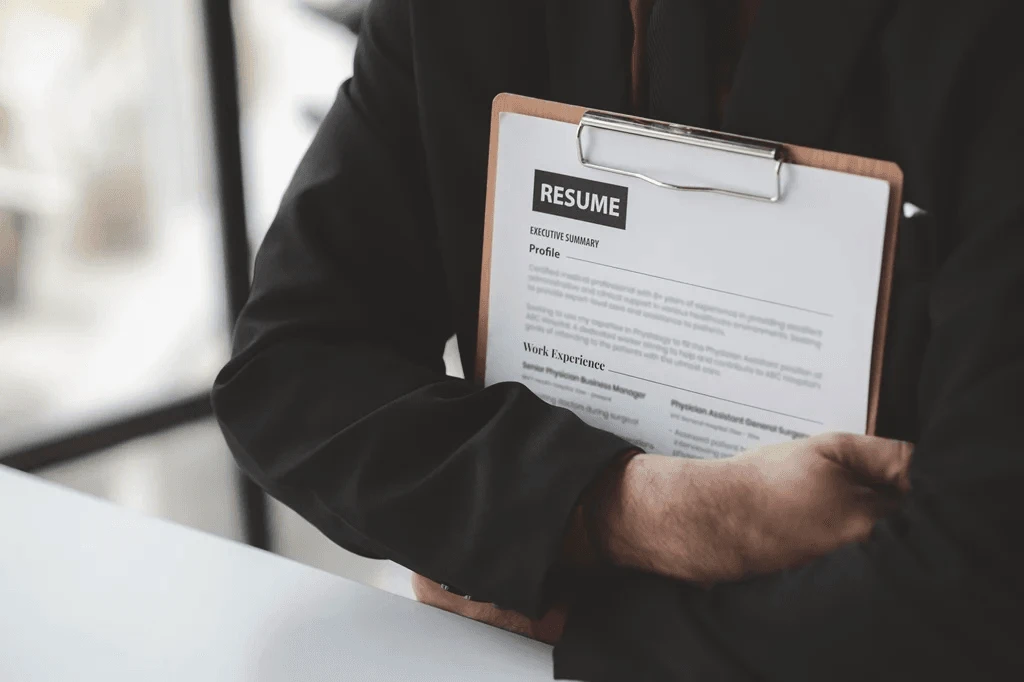 Job Applicant Holding His Resume While Waiting For An Interview