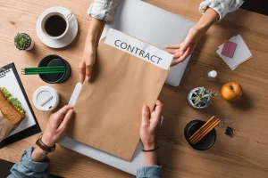 Job Candidate Receiving A Contract For A Temporary Role