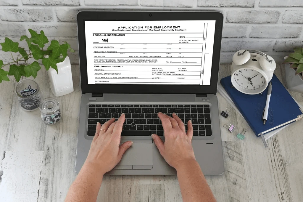 Job Seeker Filling Out An Online Job Application Form