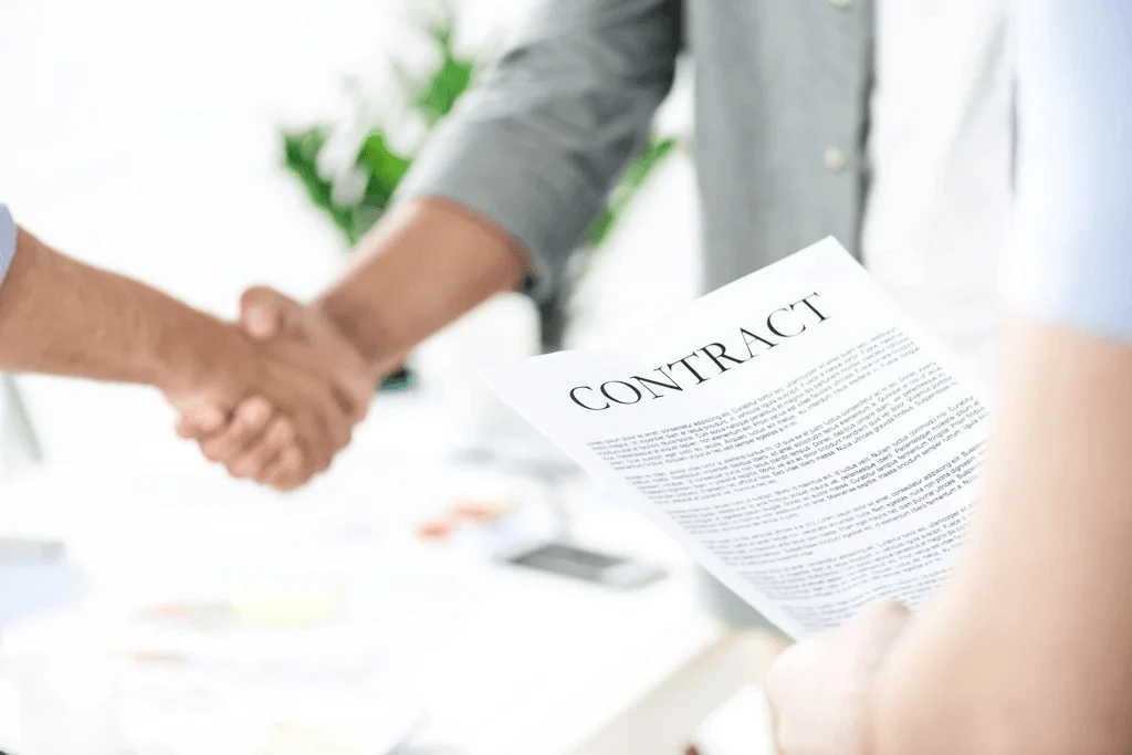 Newly Hired Employee Receiving A Contract From The Company