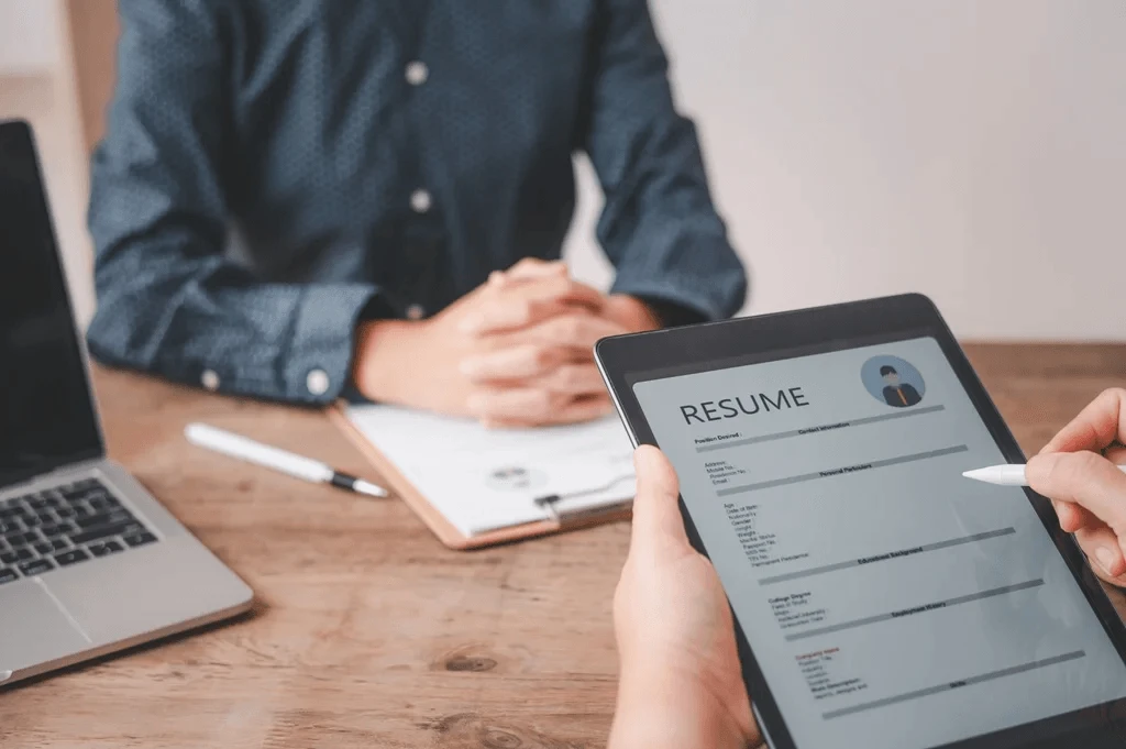 Recruiter Evaluating A Resume Of A Candidate