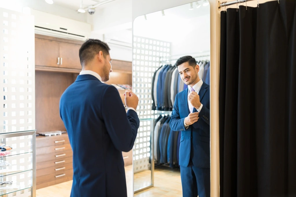 applicant fitting suit showing what to wear and not to wear for an interview to make a great first impression