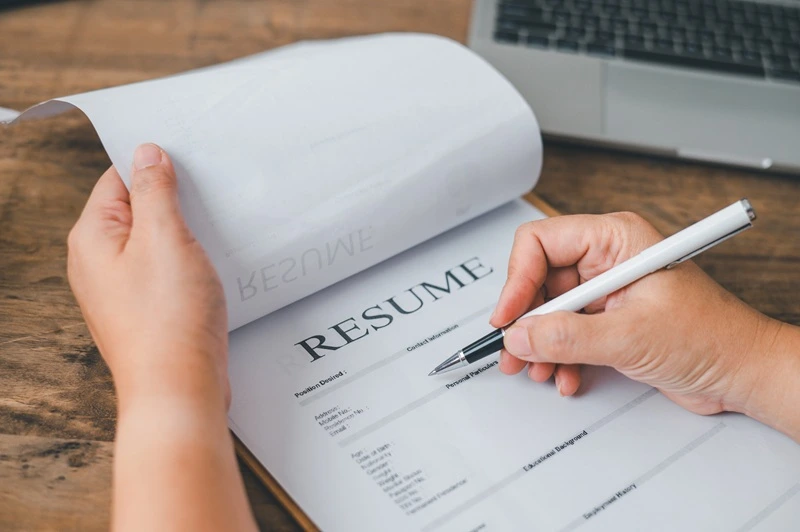 Applicant Writing Resume With Tips From A Professional Resume Guide