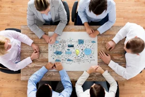 Business Professionals Reviewing Charts And Documents For Risk Assessment And Analysis