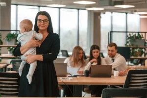 Coworking Space With Mothers Collaborating On Projects Reflecting Growing Job Opportunities For Mothers