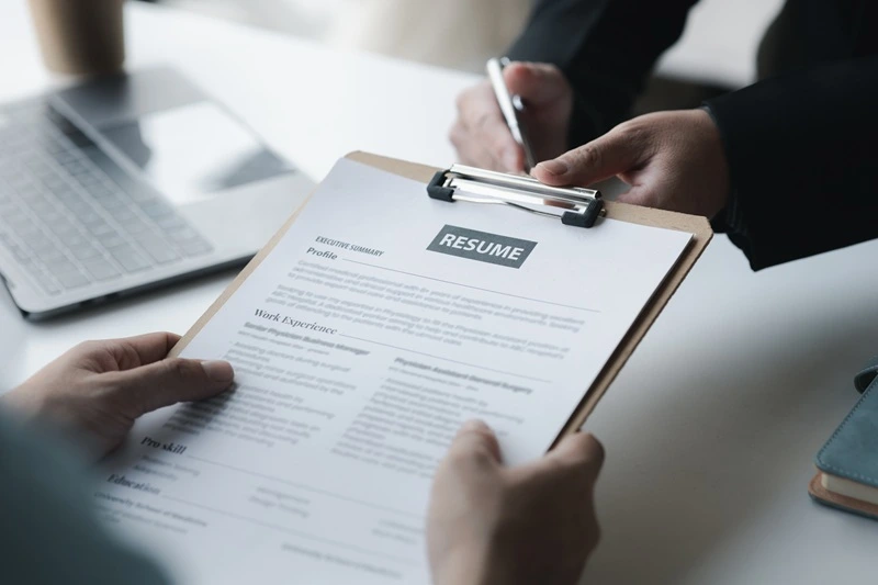 Hiring Manager Reviewing Candidate Application Created From Resume Guide
