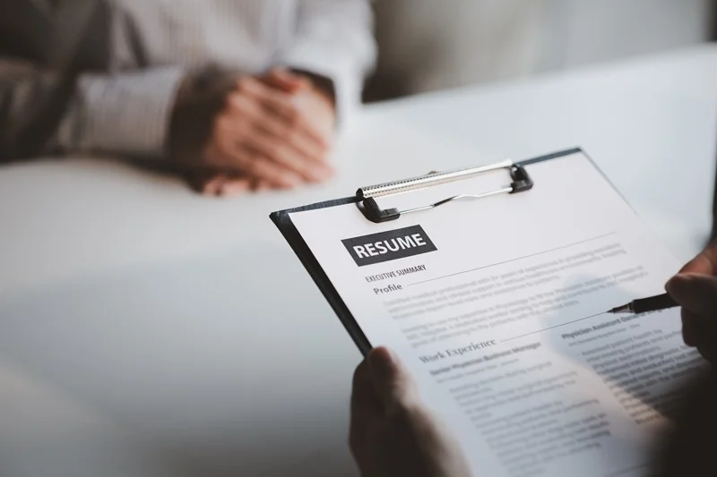 Hiring Manager Reviewing The Account Manager's Resume
