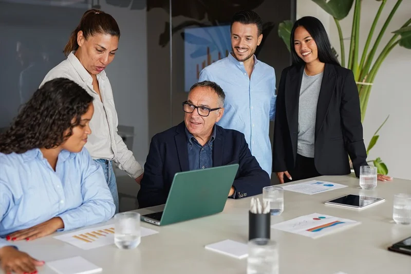 Job Seekers Demonstrating Collaboration Skills On Resume By Working Together In A Team Meeting
