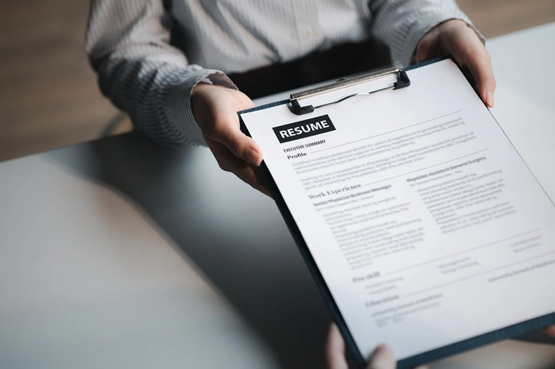 Recruiter Reviewing What Is A Resume To Shortlist Candidates For Interviews