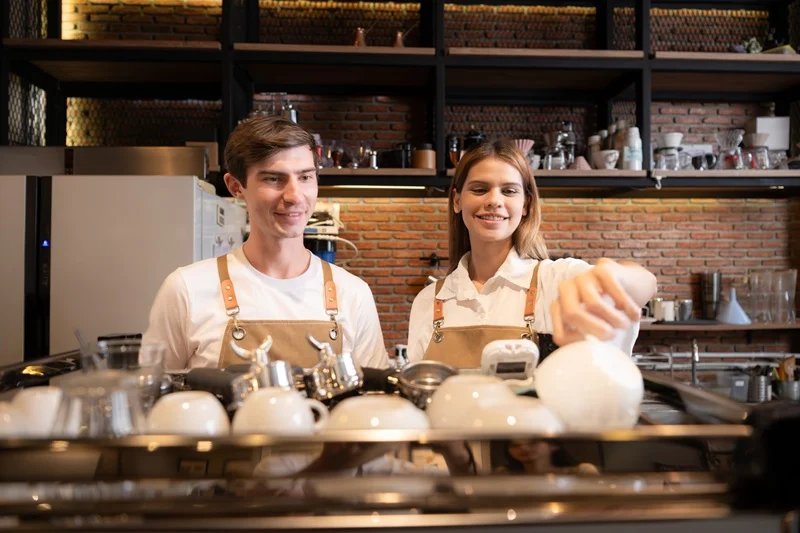Baristas Preparing Coffee, Showcasing Skills Relevant To A Server Job Description