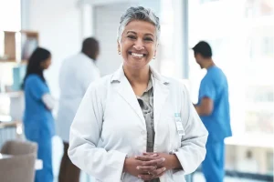 healthcare administrator smiling in a hospital setup