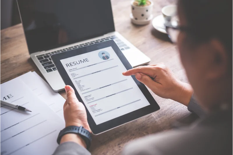 Job Seeker Reviewing Resume Before Sending